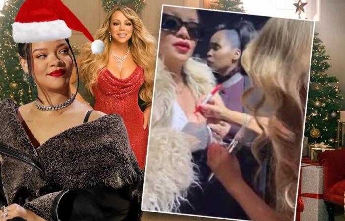 Mariah Carey gibt Rihanna ein Autogramm auf die Brust